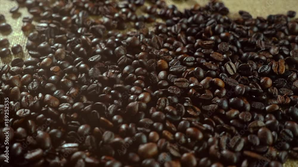 Coffee beans. Fried beans are falling in slow motion.