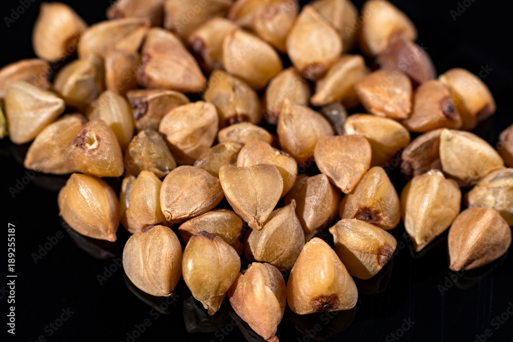 Macro collection, gluten free roasted dry boekwheat seeds close up Macro collection, gluten free roasted dry boekwheat seeds close up