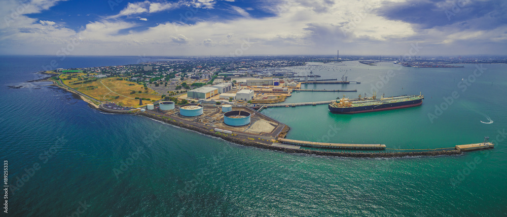 Aerial panorama of Williamstown suburb and industrial wharfs in summer. Melbourne, Australia