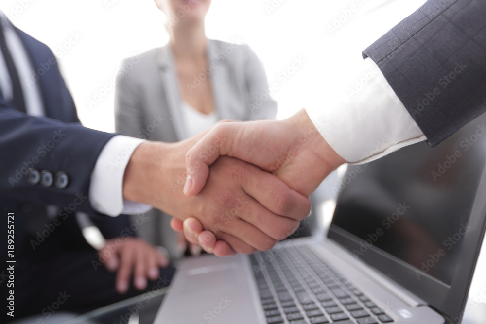 Two confidence businessman shaking hands close-up Two confidence businessman shaking hands close-up