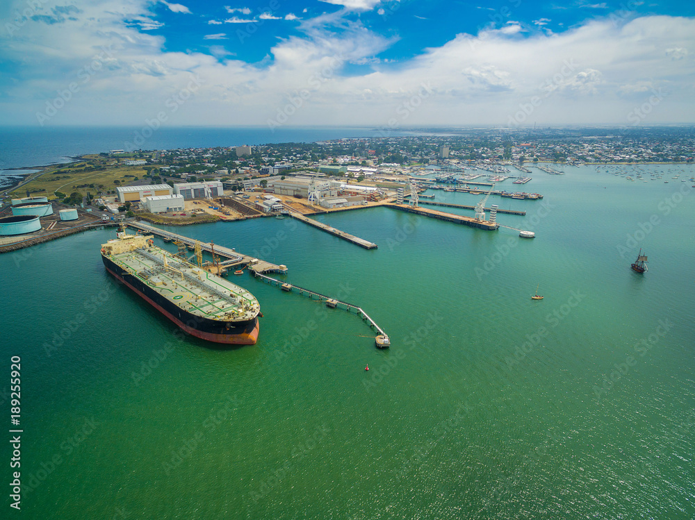 Aerial view of oil tanker moored at industrial port. Williamstown, Victoria, Australia