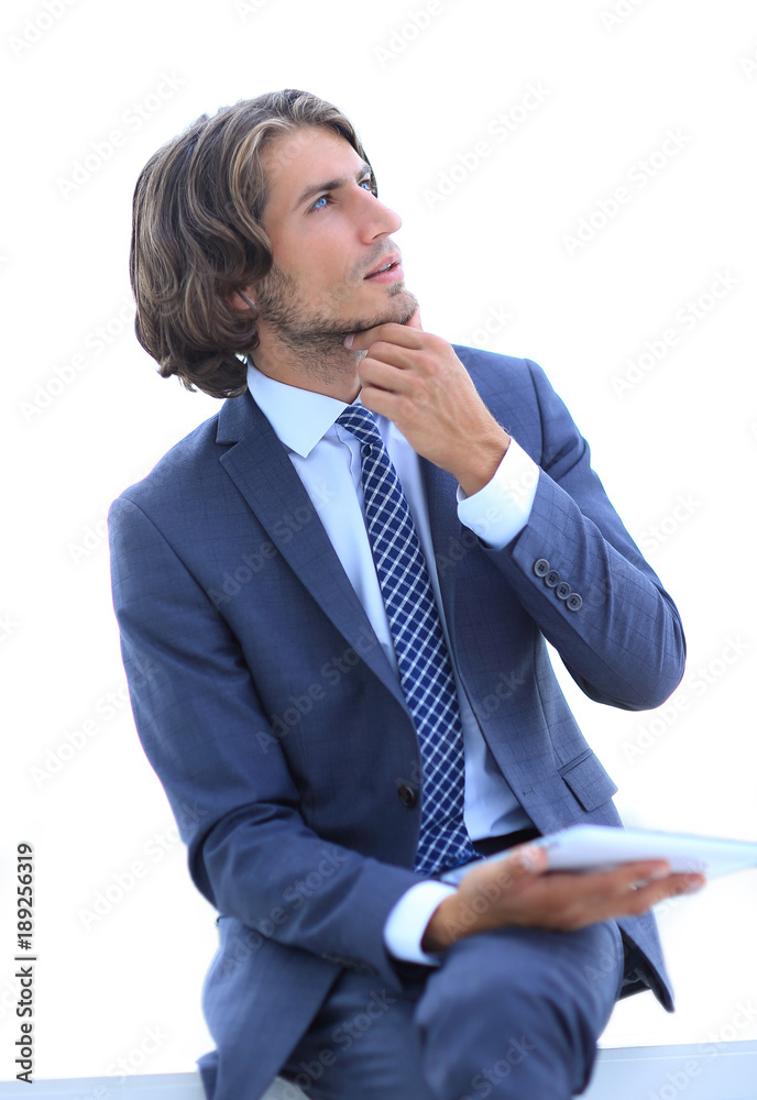 modern businessman with tablet looking at copy space modern businessman with tablet looking at copy space