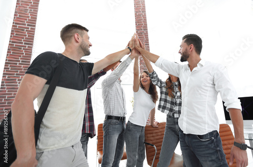 creative team giving each other a high five