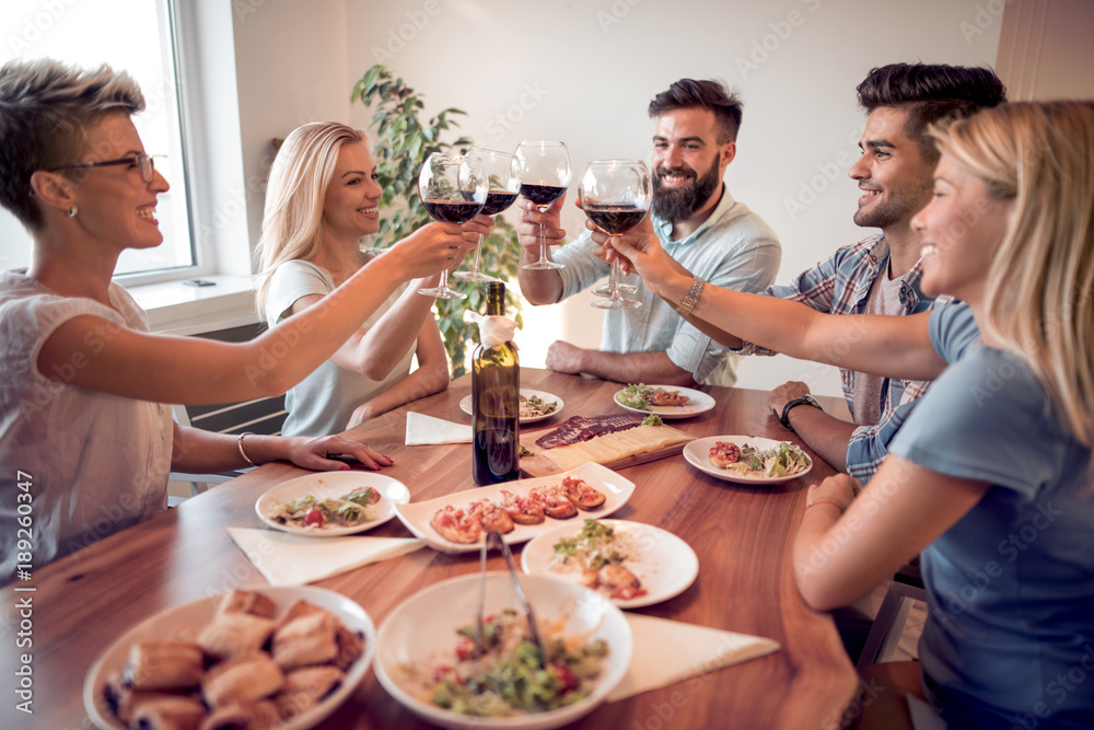 Young friends celebrate with alcohol and food Young friends celebrate with alcohol and food