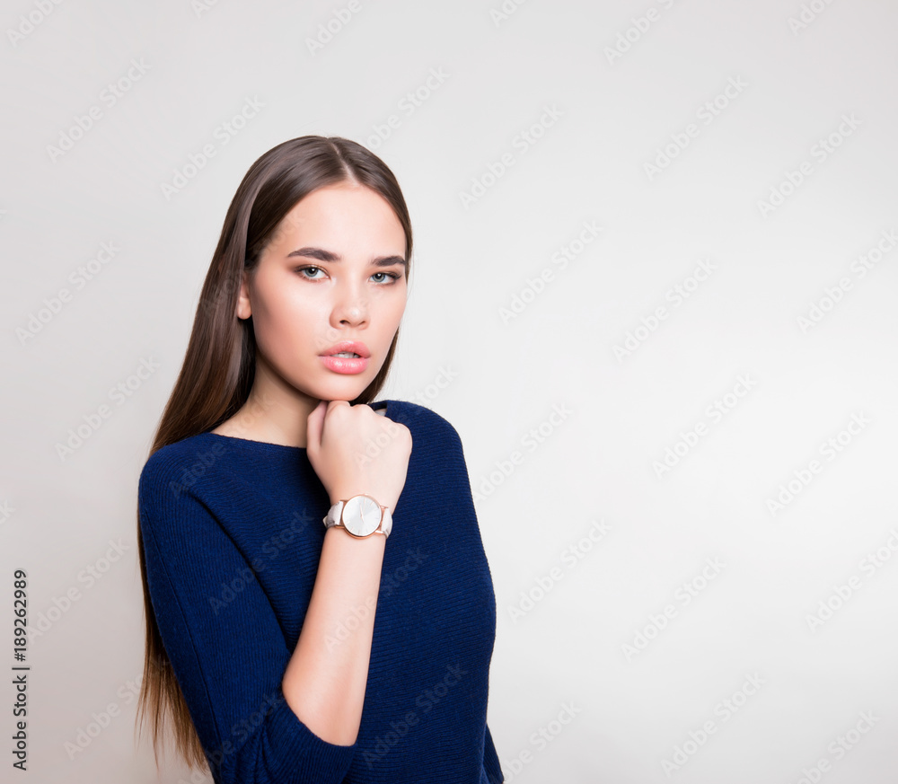 beautiful young woman with long hair wearing wrist watch beautiful young woman with long hair wearing wrist watch