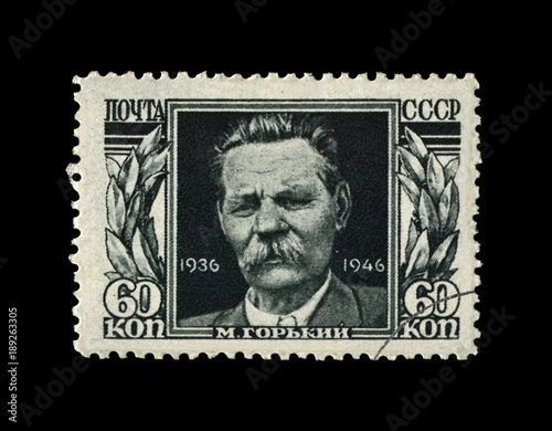 Maxim Gorky aka Alexei Maximovich Peshkov (1868-1936), famous Russian writer, dramatist, politician, circa 1946. canceled vintage stamp printed in the USSR (Soviet Union) isolated on black background. photo