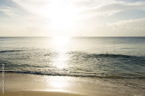 Water Waves, Beach, and Sun Setting into Ocean for Backgrounds © photographyfirm