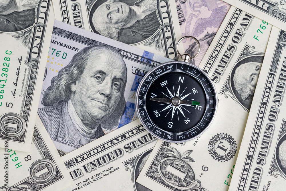 Direction of United States financial concept, compass on US Dollar banknotes using as leadership of country guidance after government shutdown Direction of United States financial concept, compass on US Dollar banknotes using as leadership of country guidance after government shutdown