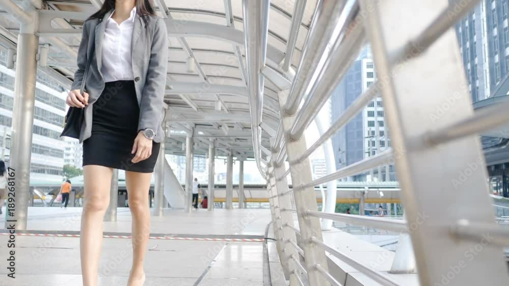 Asian business woman walking at city. Asian business woman walking at city.