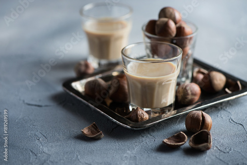 Cream liqueur with hazelnuts, homemade, selective focus, toned image