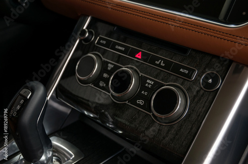Modern car dashboard. Control buttons. Interior detail. © alexdemeshko