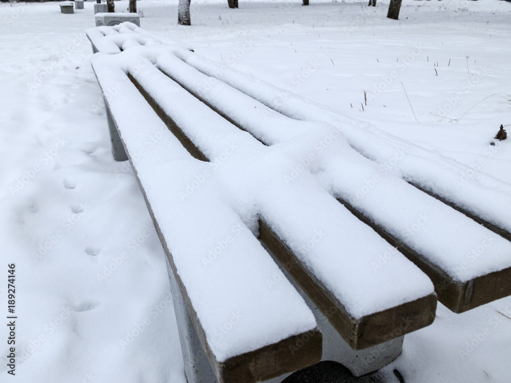 snowfall. bench in the Park covered with snow snowfall. bench in the Park covered with snow