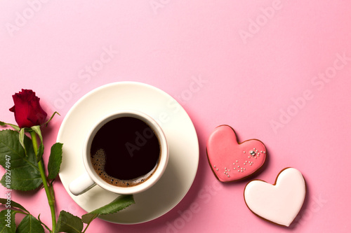 Valentine day background with hearts, roses and a cup of coffee. Top view with space for your text