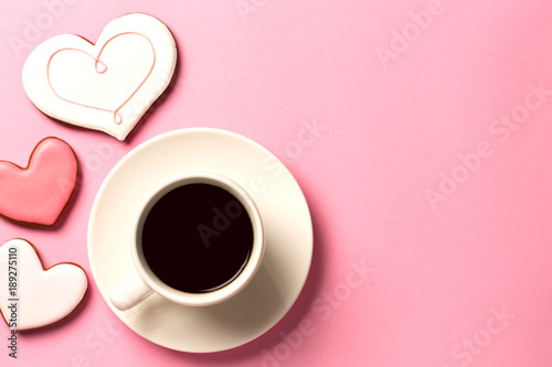Morning valentine day concept background with hearts and a cup of coffee. Top view with space for your text