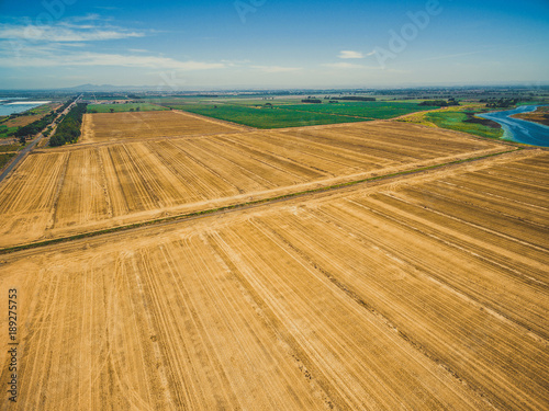 Beautiful aerial view of plowed field on bright summer day