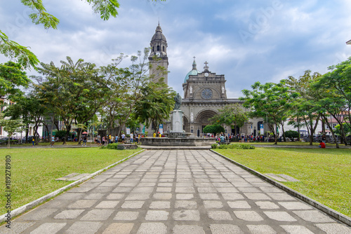 Tourists and cataclysmic tourists visiting the Manila Cathedral Gardens