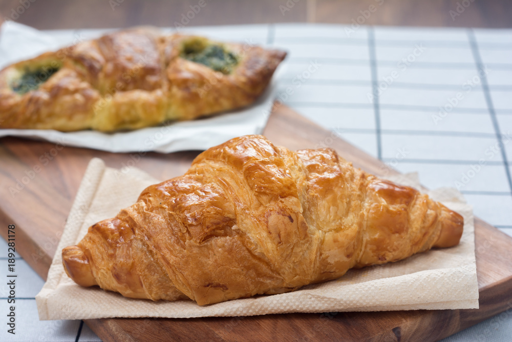 Croissant and Cutting Board on Dining table.