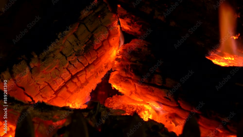 Close up 4K video clip of logs burning in a traditional fireplace. Close up 4K video clip of logs burning in a traditional fireplace.