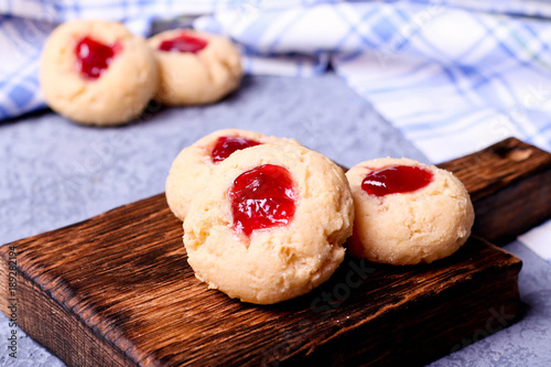 Cookies with jam, biscuits on a brown desk