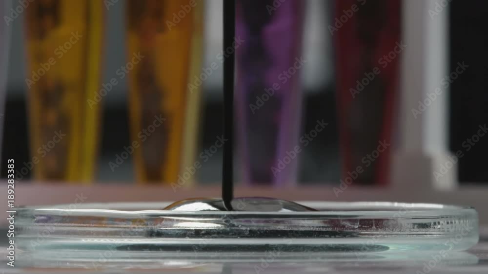 Oil Fills Lab Cap and Test-tubes with Bright Liquids Macro Oil Fills Lab Cap and Test-tubes with Bright Liquids Macro