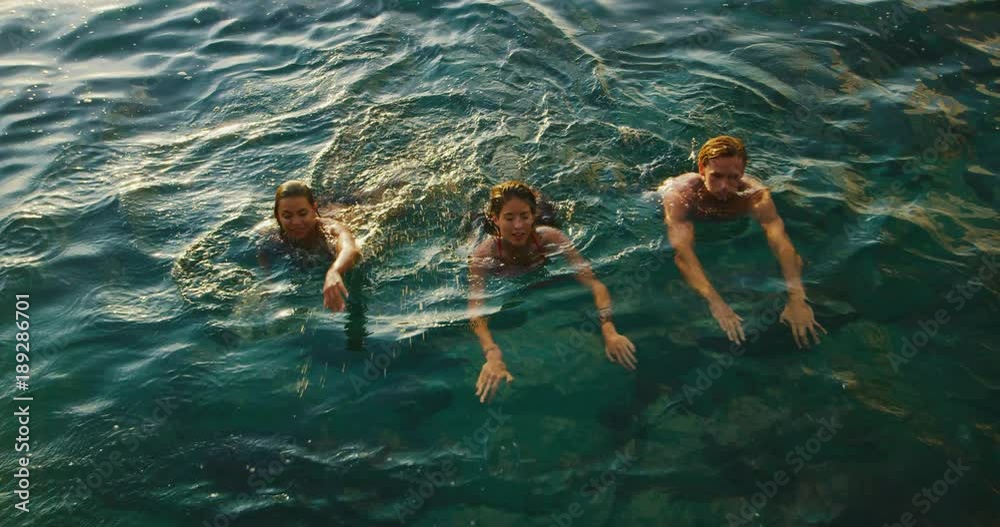 Friend relaxing swimming in the ocean