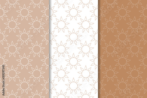 Brown and white geometric ornaments. Set of seamless patterns