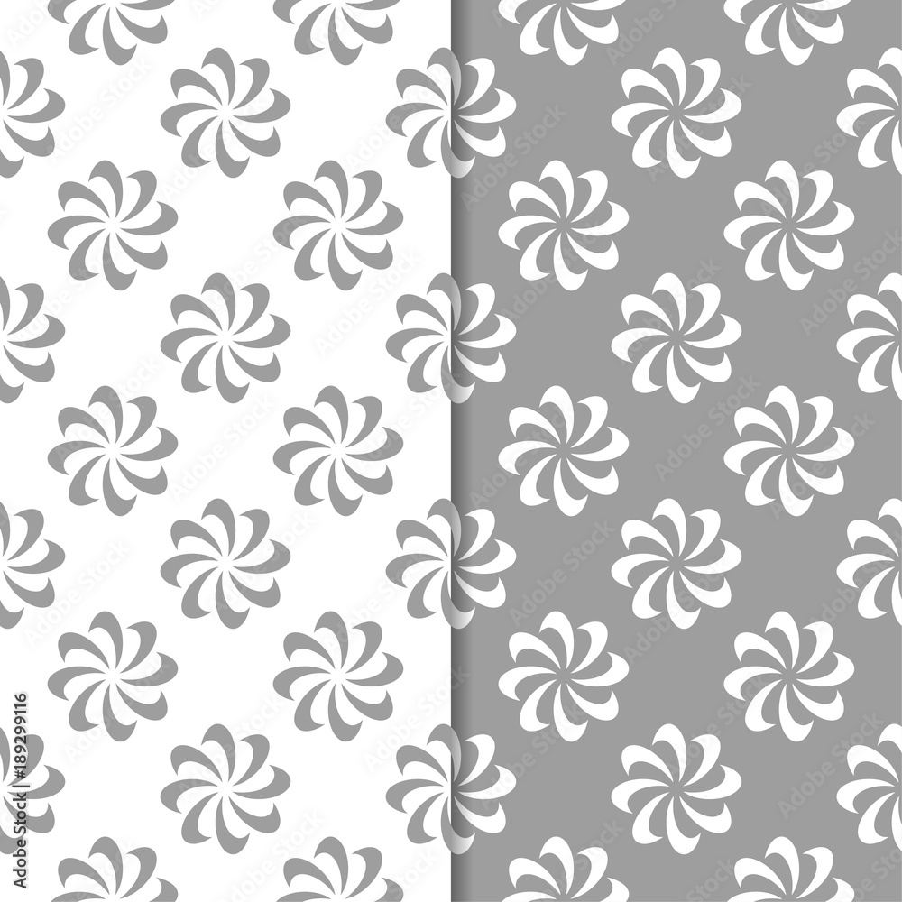 White and gray floral ornamental designs. Set of seamless patterns White and gray floral ornamental designs. Set of seamless patterns