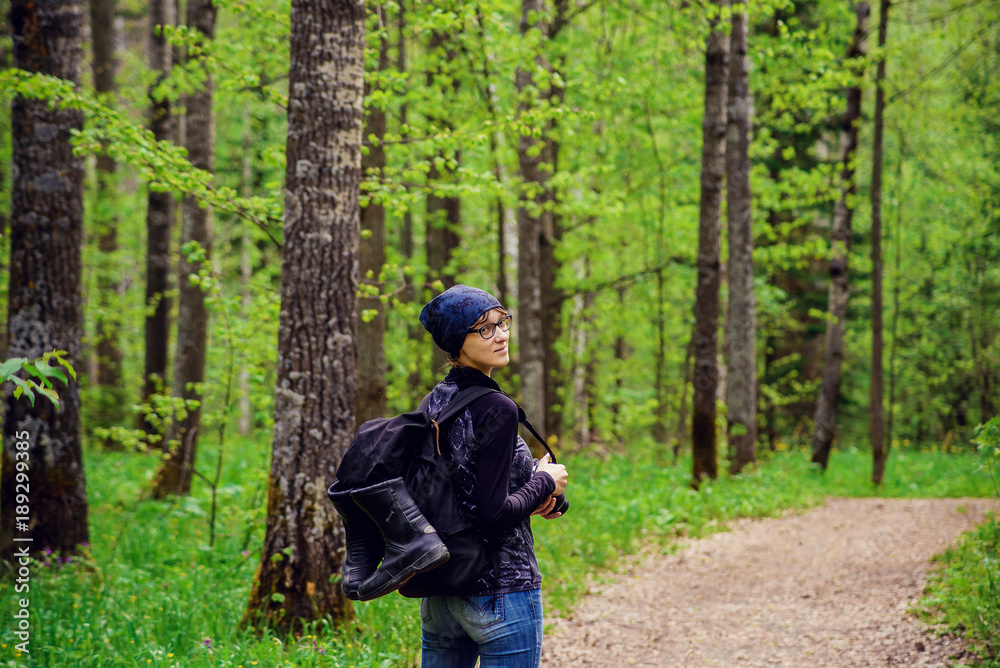 Naklejka premium Beautiful young girl with a backpack in the tourism campaign