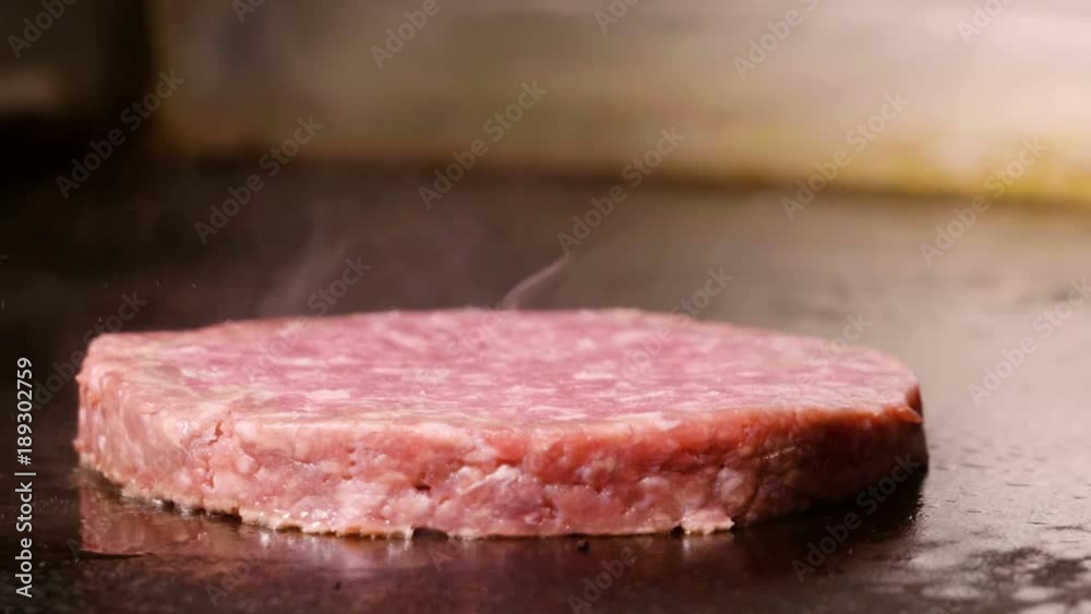 Food industry. Close up slow motion shot of beef cutlet roasted on grill pan. HD Food industry. Close up slow motion shot of beef cutlet roasted on grill pan. HD
