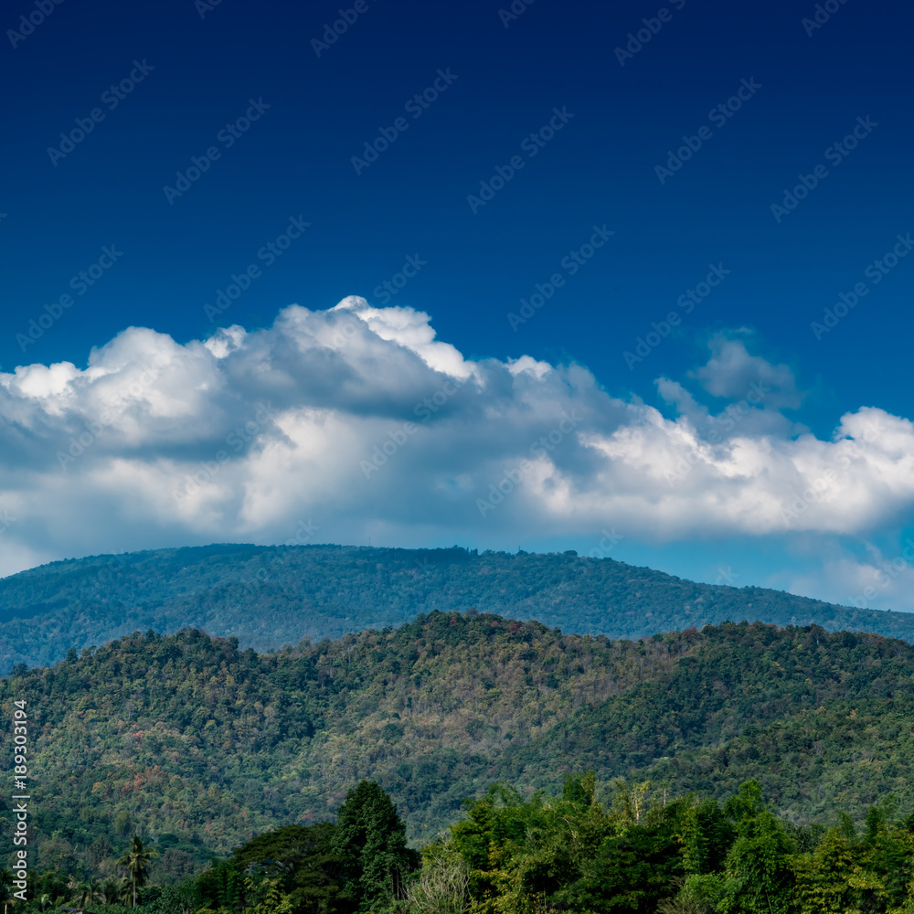 Mountain with white cloud on Blue sky