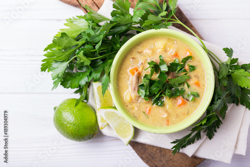 Indian Mulligatawny soup with lentil, parsley. Copyspace, top view. photo