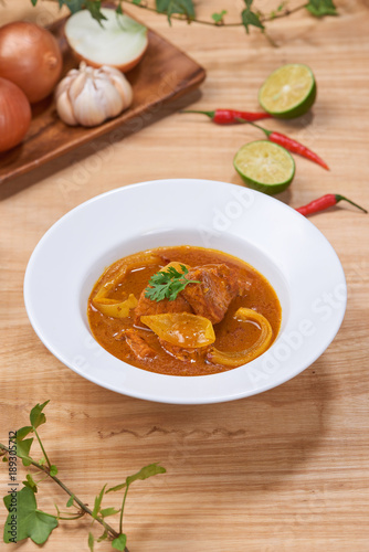 Chicken curry in a bowl / Vietnam chicken curry on wooden background