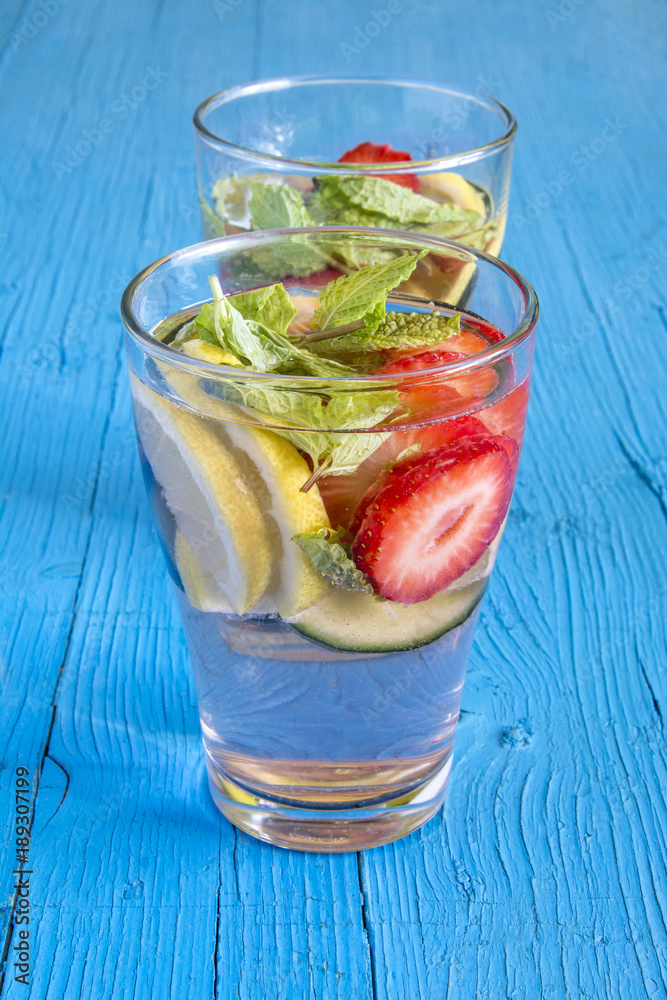 Dietary detox drink with lemon juice, strawberries and cucumber. Dietary detox drink with lemon juice, strawberries and cucumber.