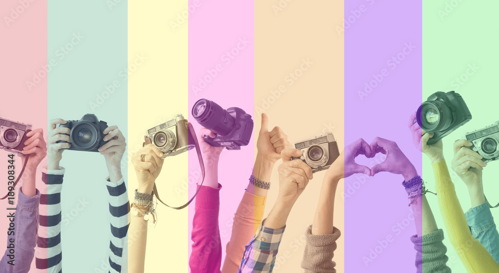 Different color hands and cameras also colorful background - obrazy, fototapety, plakaty 