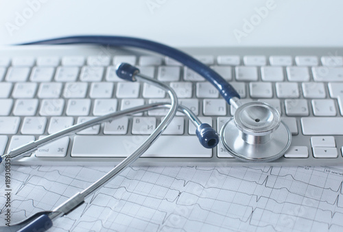 Close up of stethoscope on pc keyboard. Healthcare concept