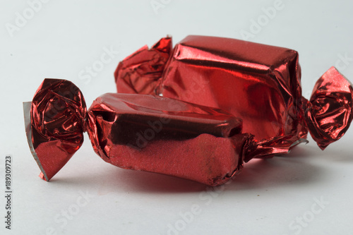 Square candy in red wrappers