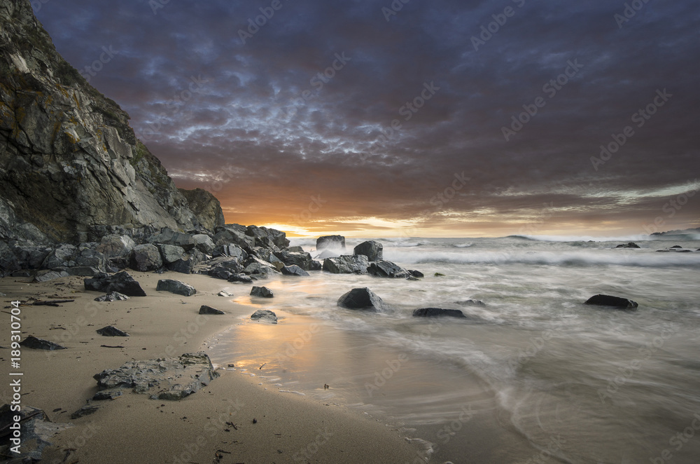 Natural rocks in the sea with beautiful sunset sky on the beach of Silistar, Bulgaria