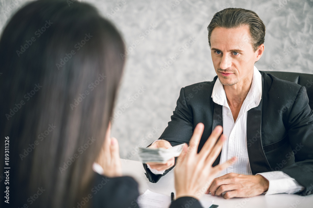 Business man sending money to business woman, corruption and anti corruption concept Business man sending money to business woman, corruption and anti corruption concept