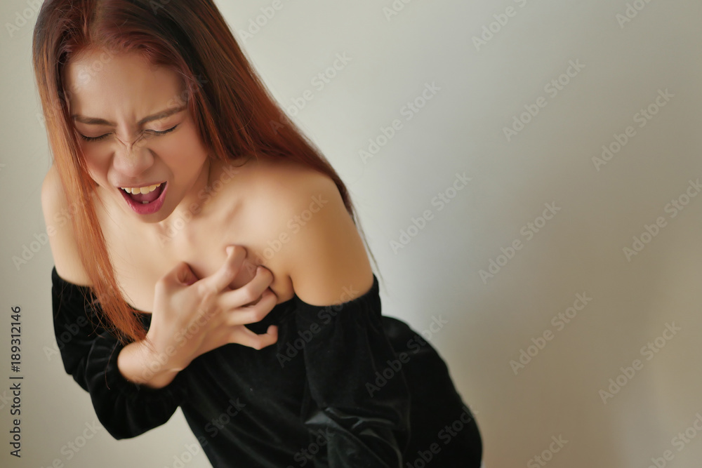 woman suffering from acute heart attack woman suffering from acute heart attack