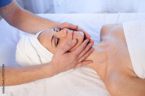 girl masseur doing massage neck face spa health