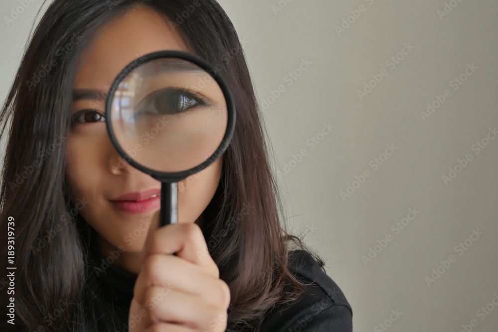 woman searching, viewing, finding with magnifying glass, girl searching concept woman searching, viewing, finding with magnifying glass, girl searching concept