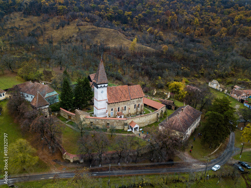 Mesendorf fortified church in a traditional saxon village in Transylvania, Romania photo