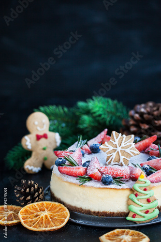 Delicious Christmas ginger cheesecake with fresh berries decoration © kate_smirnova