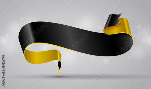 Black and gold curved ribbon or banner on shiny grey background