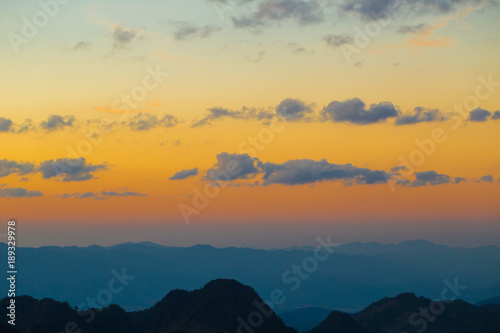 Majestic sunset coulourful sky mountain layer photo