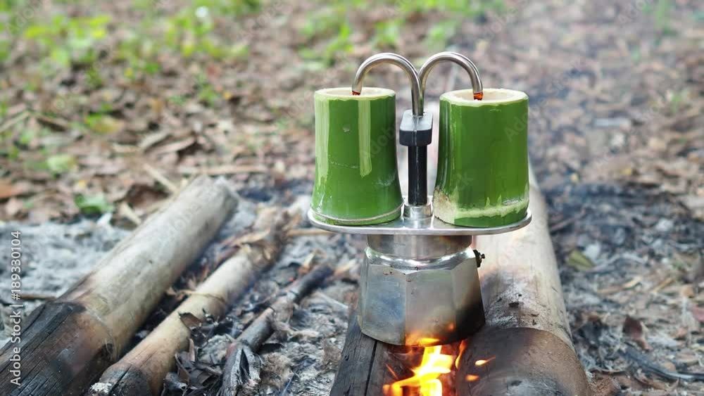 Making double shots coffee with moka pot and bamboo cup. Making double shots coffee with moka pot and bamboo cup.