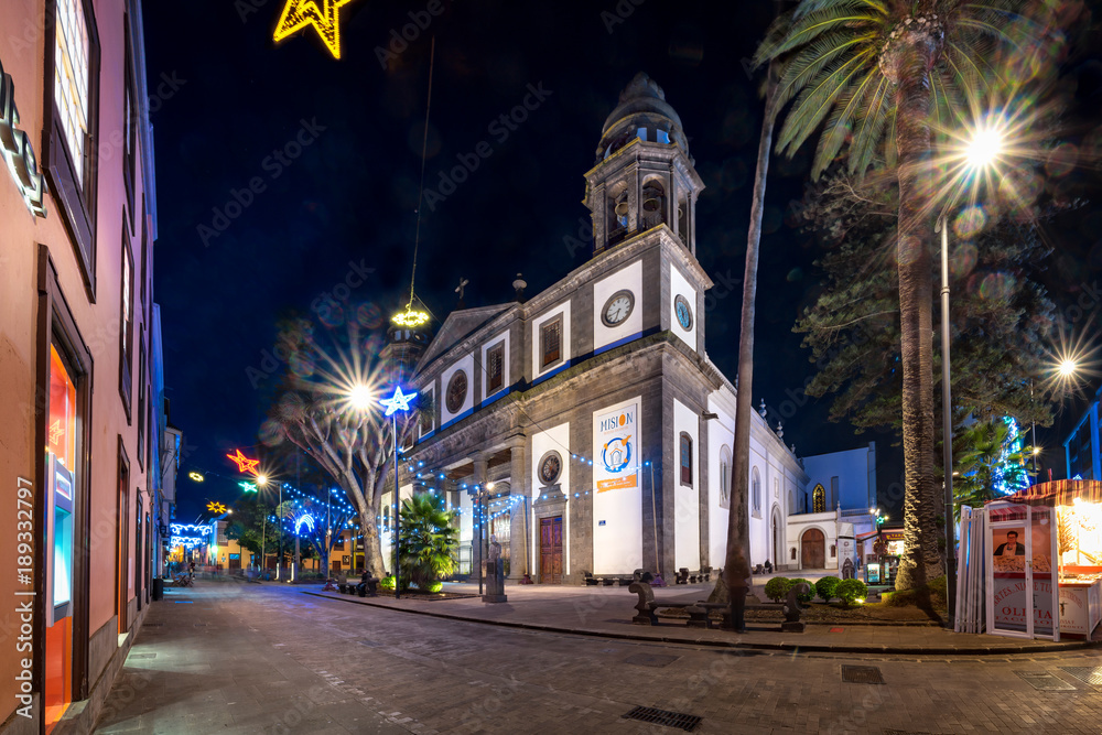 San Cristobal de La Laguna, Tenerife, Spain - December 8, 2017: Cathedral de Nuestra Senora de los Remedios at night within Christmas street decoration.