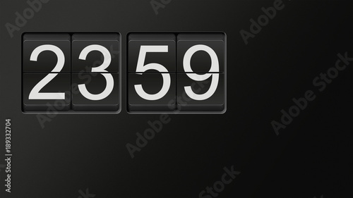 Classic flip clock watch face showing hour and minutes set to 23:59 with white numbers on black background; great copy space; nobody