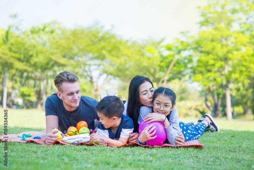 Happy Family is enjoy picnic on garden, family vacation background