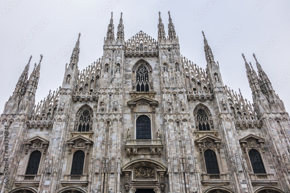 Architectural fragment of Milan Cathedral (Duomo di Milano, 1386), dedicated to St Mary of the Nativity (Santa Maria Nascente), with Gothic and Lombard Romanesque style. Milan, Italy.